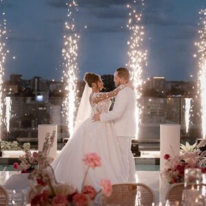 Bride and groom dancing with Osmic cold-spark fountains at a wedding reception