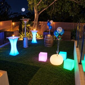 Illuminated LED cocktail tables, cubes and spheres at an outdoor evening event