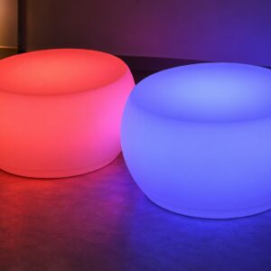 Round illuminated LED coffee tables glowing red and violet