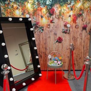 Rustic Backdrop with Greenery and Festoon Lights | Osmic Productions