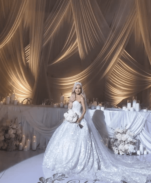 Wedding reception with ceiling draping and table styling