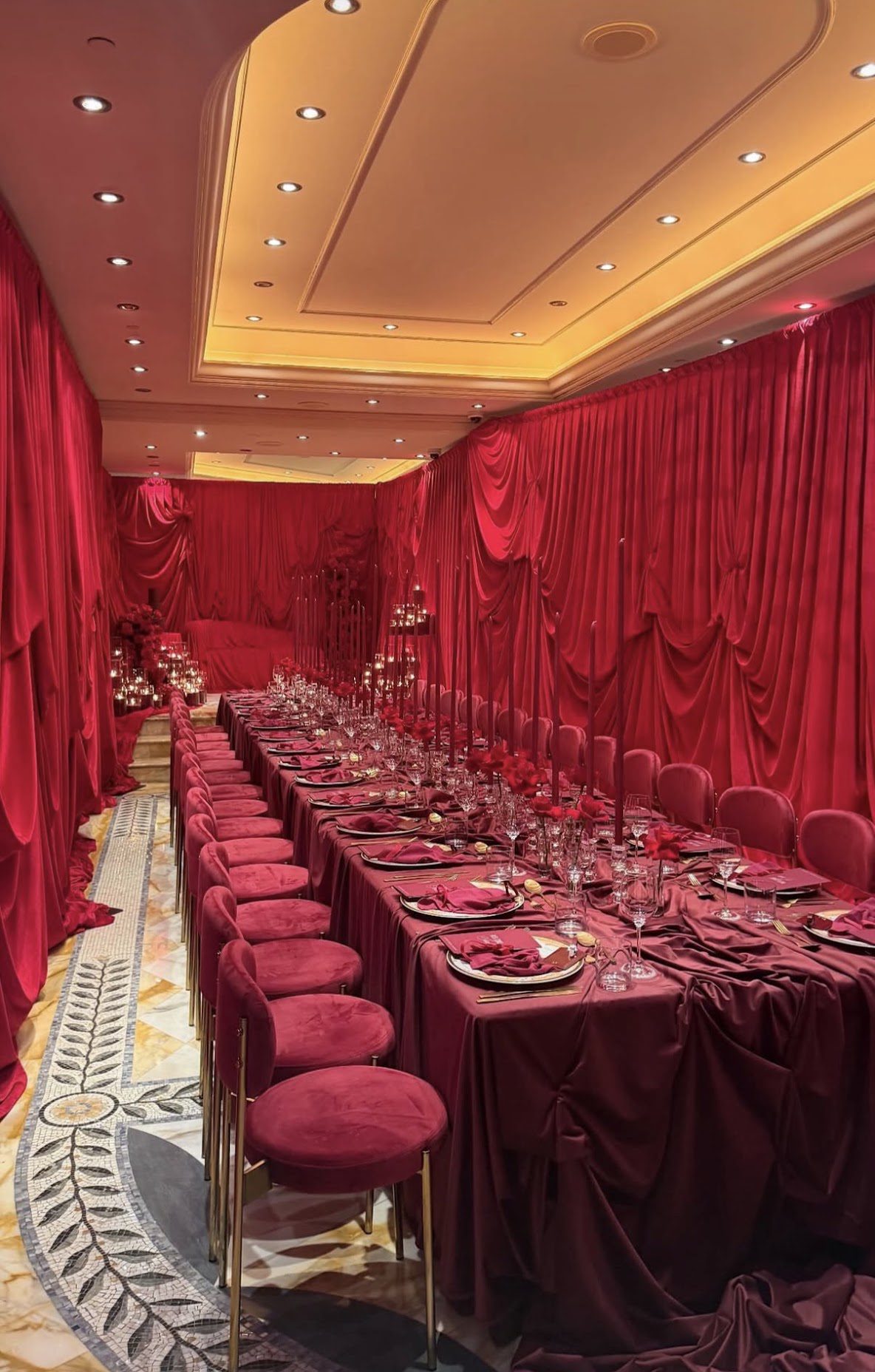 Red draping and coordinated banquet table styling