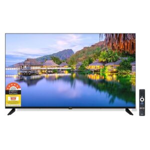 Flat-screen Tv on a Stand, Showing a Tropical Lagoon Scene; Remote on the Right and Energy Rating Sticker Bottom-left.