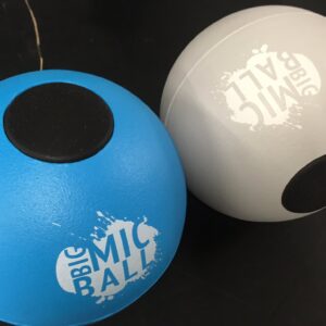 Cphqrewgaaqtcq | Osmic Productions Close-up of Blue and Gray Balls with Black Patches; a Partial White 'big Bal' Logo is Visible on the Gray Ball.