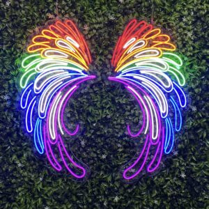 Rainbow neon wings displayed against a green foliage wall.