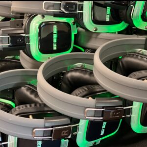 Stacked over-ear headphones with gray bands and black cushioned ear pads, highlighted by neon green LED trim.