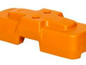 Orange plastic clamp/jig-like tool part with interlocking sections, used to hold or align components.