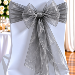 Organza Dark Silver Shimmer | Osmic Productions White Banquet Chair with a Shimmery Silver Ribbon Bow Tied at the Back