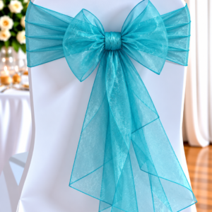 White Chair Cover with a Large Turquoise Organza Bow Tied at the Back, a Wedding/decorative Seating Detail