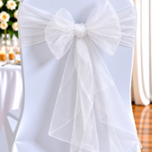 Organza White | Osmic Productions White Chair Cover Tied with a Large Sheer Organza Bow for a Wedding Decoration