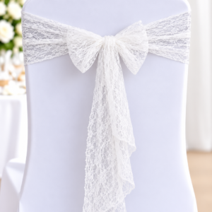 White chair cover with a lace sash tied in a bow at the back, a wedding decor detail.