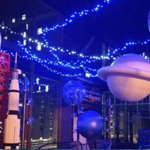 Inflatable planets and space-themed display elements in an exhibition setting